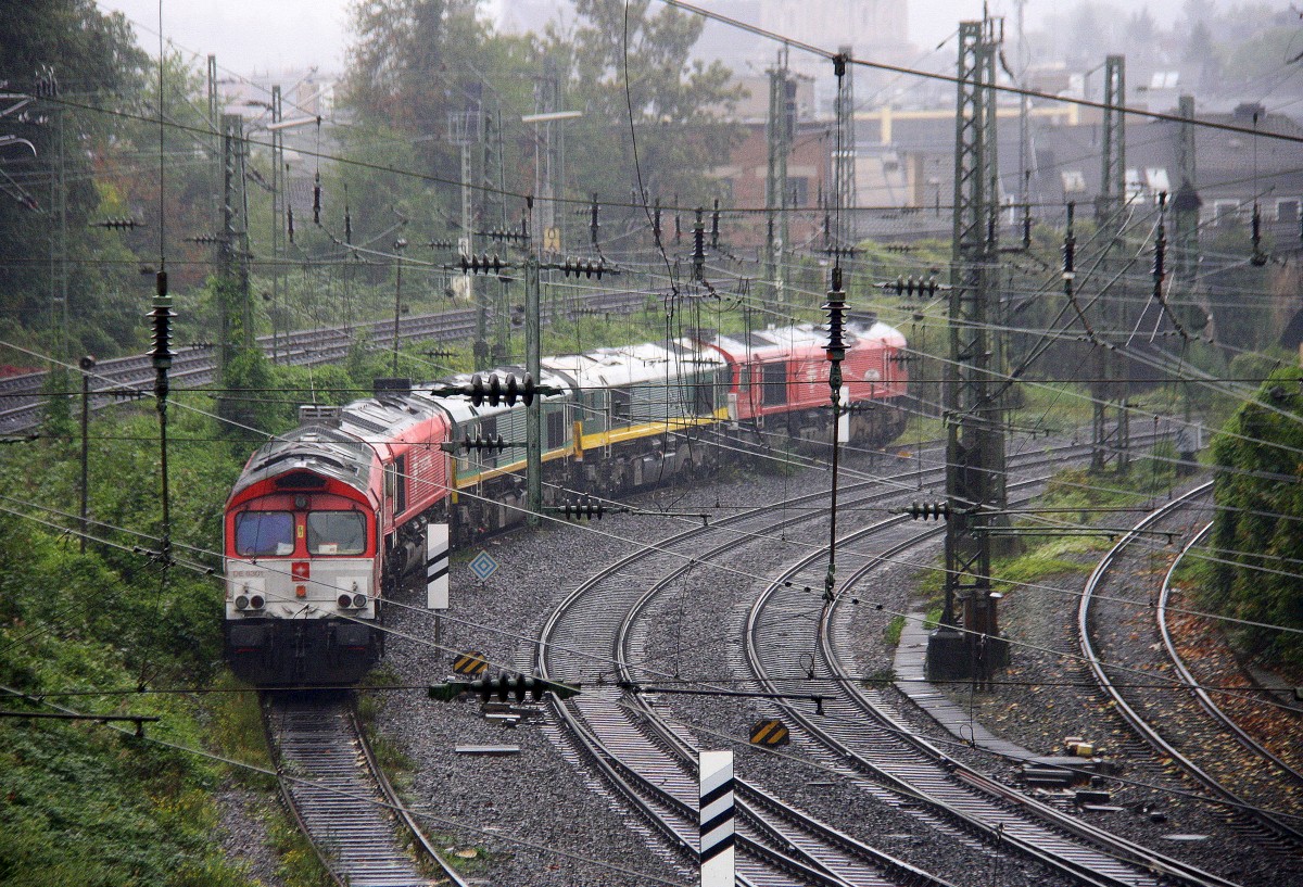 Fünf Class 66 DE6301  Debora ,DE6311  Hanna ,PB15 von Railtraxx BVBA,29002,DE6314  Hanna  alle von Crossrail stehen auf dem Abstellgleis in Aachen-West. 
Aufgenomen von der Brücke der Turmstraße in Aachen bei Regenwetter am Mittag vom 5.10.2014.
