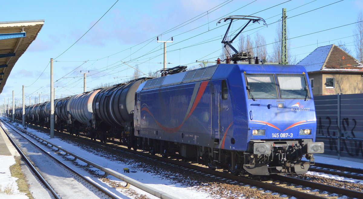 HSL Logistik GmbH, Hamburg [D]  mit der SRI Lok  145 087-3  [NVR-Nummer: 91 80 6145 087-3 D-SRI] und Kesselwagenzug am 12.02.21 Berlin-Blankenburg.