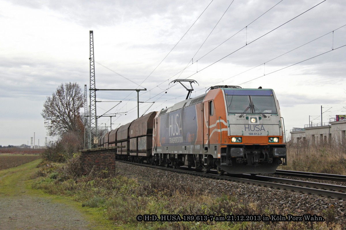 HUSA 185 613-7 mit einem Kohlezug am 21.12.2013 in Köln Porz Wahn.
