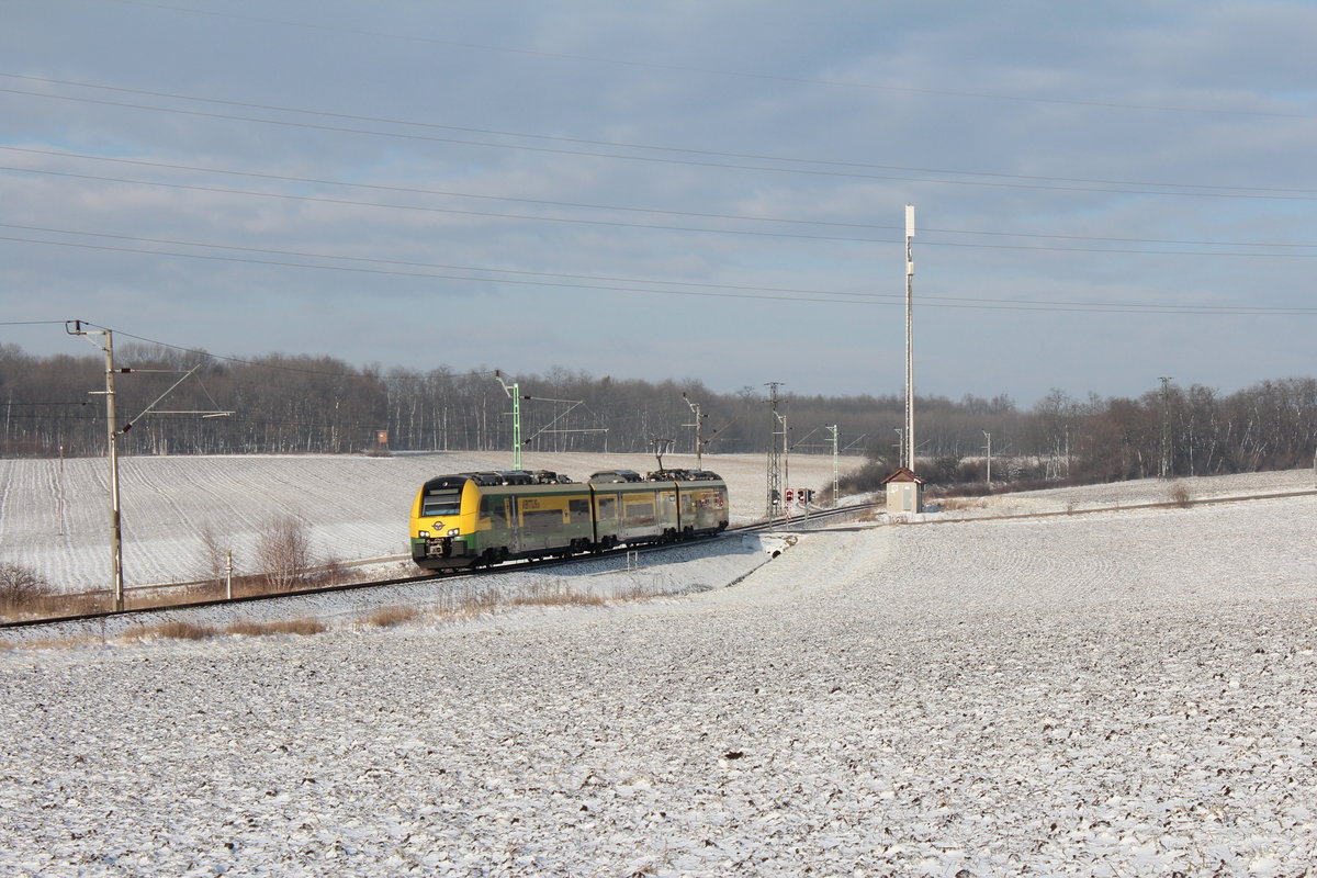 In den wenigen Sonnenfenstern des 16.1.2018 fährt der  VENTUS  4744 302 als E7608 von Bratislava Petrzalka nach Deutschkreuz hier zwischen Neufeld an der Leitha und Müllendorf. (GySEV-Strecke Ebenfurth - Wulkaprodersdorf - Sopron).