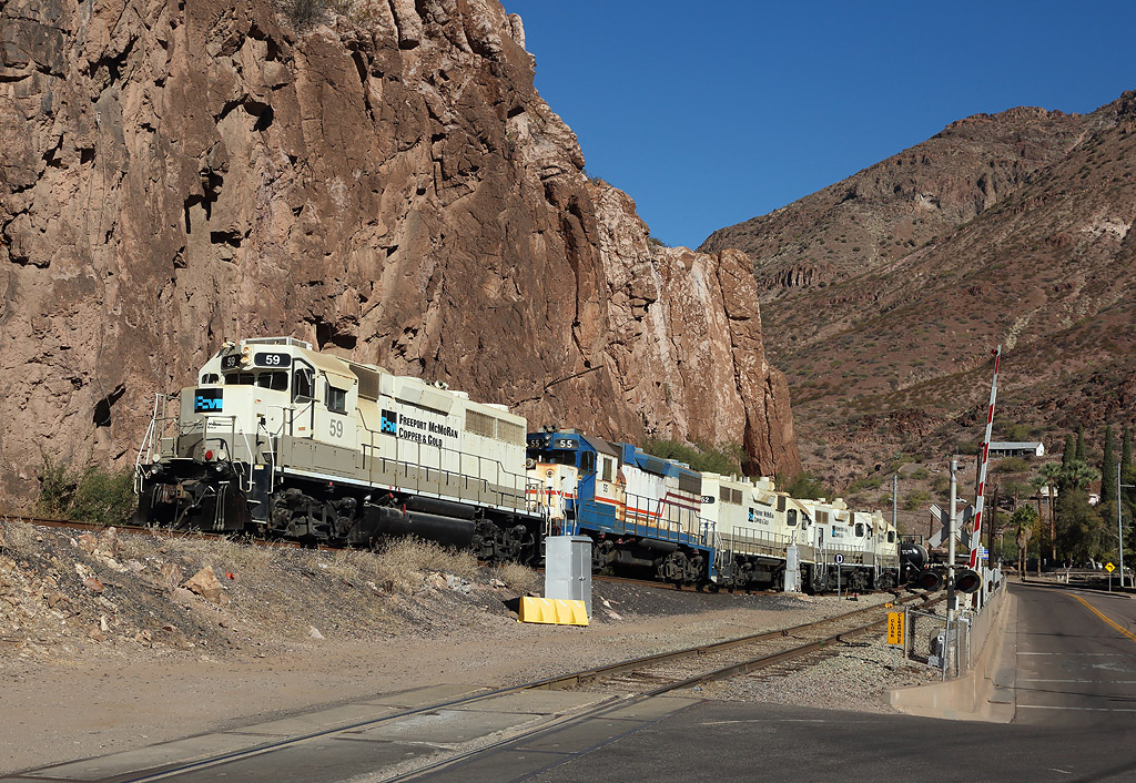 Interchanging with the Arizona Eastern, 59, 55, 52, 49 & 50 drop in to the yard in Clifton.

They will haul the secon of three trains up the steeply graded line from Clifton to Morenci