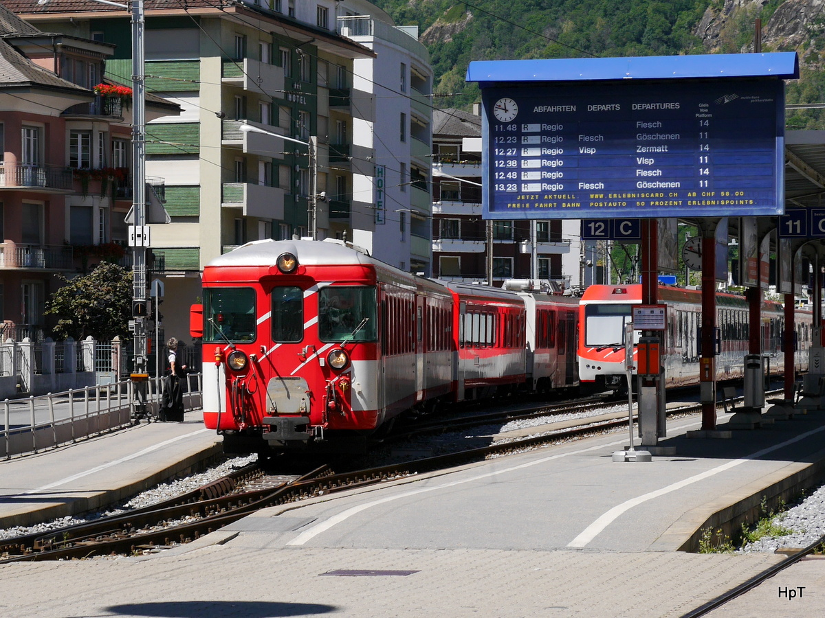 MGB - Ausfahrender Regio in Brig an der Spitze der Steuerwagen ABt 2253 am 16.07.2016