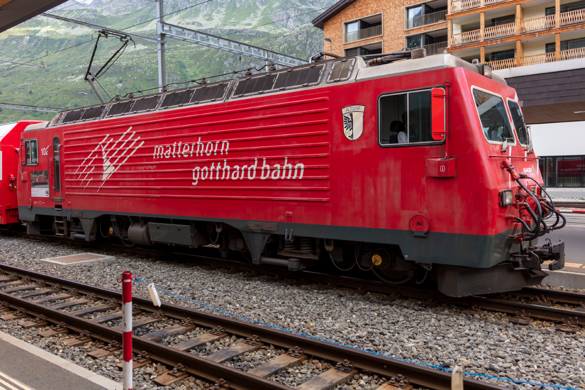 MGB, HGe 4/4II, 102, ( Werbung: Lok 16 ), 26.06.2022, Andermatt
