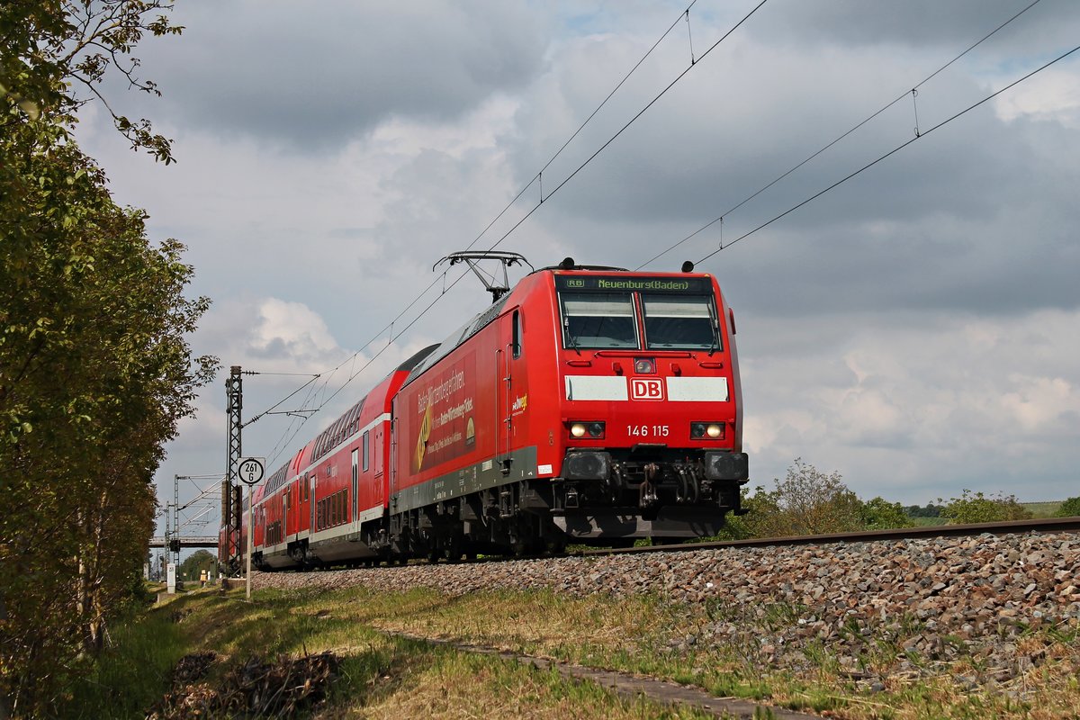 Mit einer RB (Freiburg (Brsg) Hbf - Neuenburg (Baden)) fuhr am Nachmittag des 19.05.2019 die Freiburger 146 115  Landkreis Breisgau-Hochschwarzwald  bei Hügelheim über die Rheintalbahn in Richtung Müllheim (Baden).