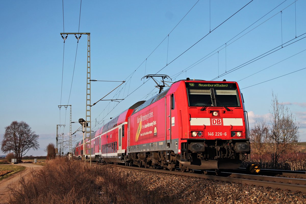 Mit einer RB (Offenburg - Neuenburg (Baden)) fuhr am 14.03.2018 die 146 226-6  Baden Württemberg erfahren  nördlich von Müllheim (Baden) durchs Rheintal gen Zielbahnhof, welcher nur noch wenige Kilometer entfernt ist.