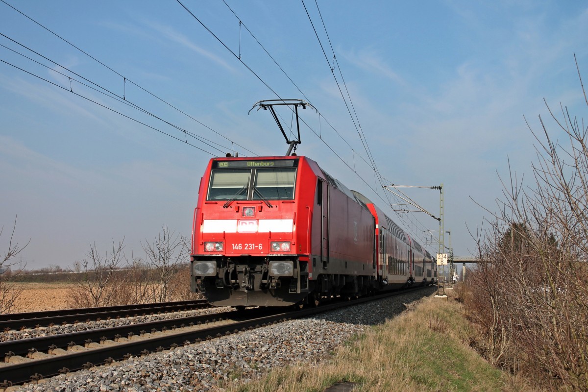 Nachschuss am 08.03.2014 auf die Freiburger 146 231-6, die an diesem Tag mit einem RE von Basel Bad Bf nach Offenburg unterwegs war, beim Müllheimer Ortsteil Hügelheim.