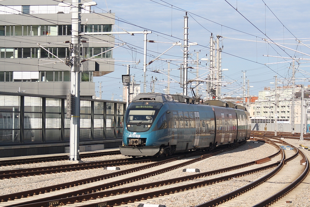ÖBB 4124 013-6 als S80 (Zug 25014)von Meidling nach Hirschstetten fährt am 15.August 2014 in den erst halbfertigen Wiener Hauptbahnhof ein.
