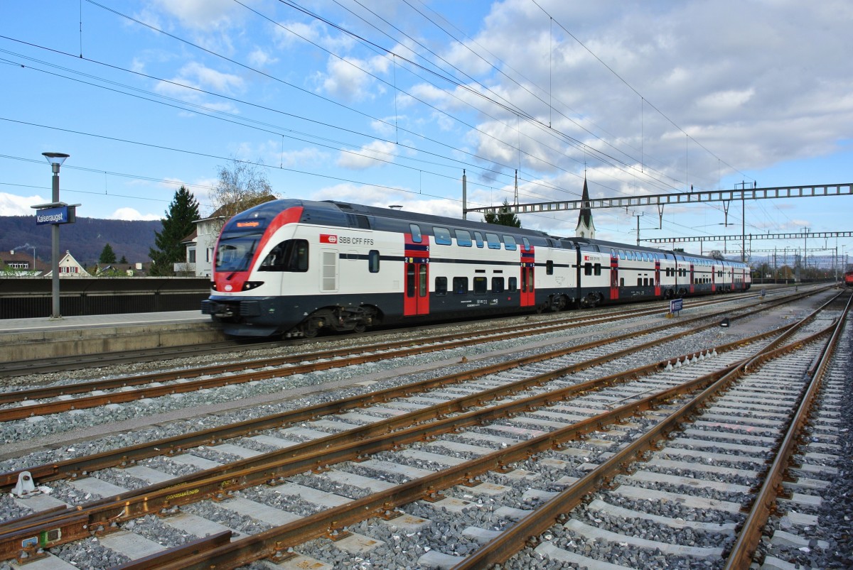 RABe 511 123 auf berfhrungsfahrt Zrich-Basel bei Durchfahrt in Kaiseraugst. Ab Fahrplanwechsel verkehren die Flugzge Basel-Zrich Flughafen, als erste in der Region, mit diesen neuen Regio Dostos, 25.11.2013.