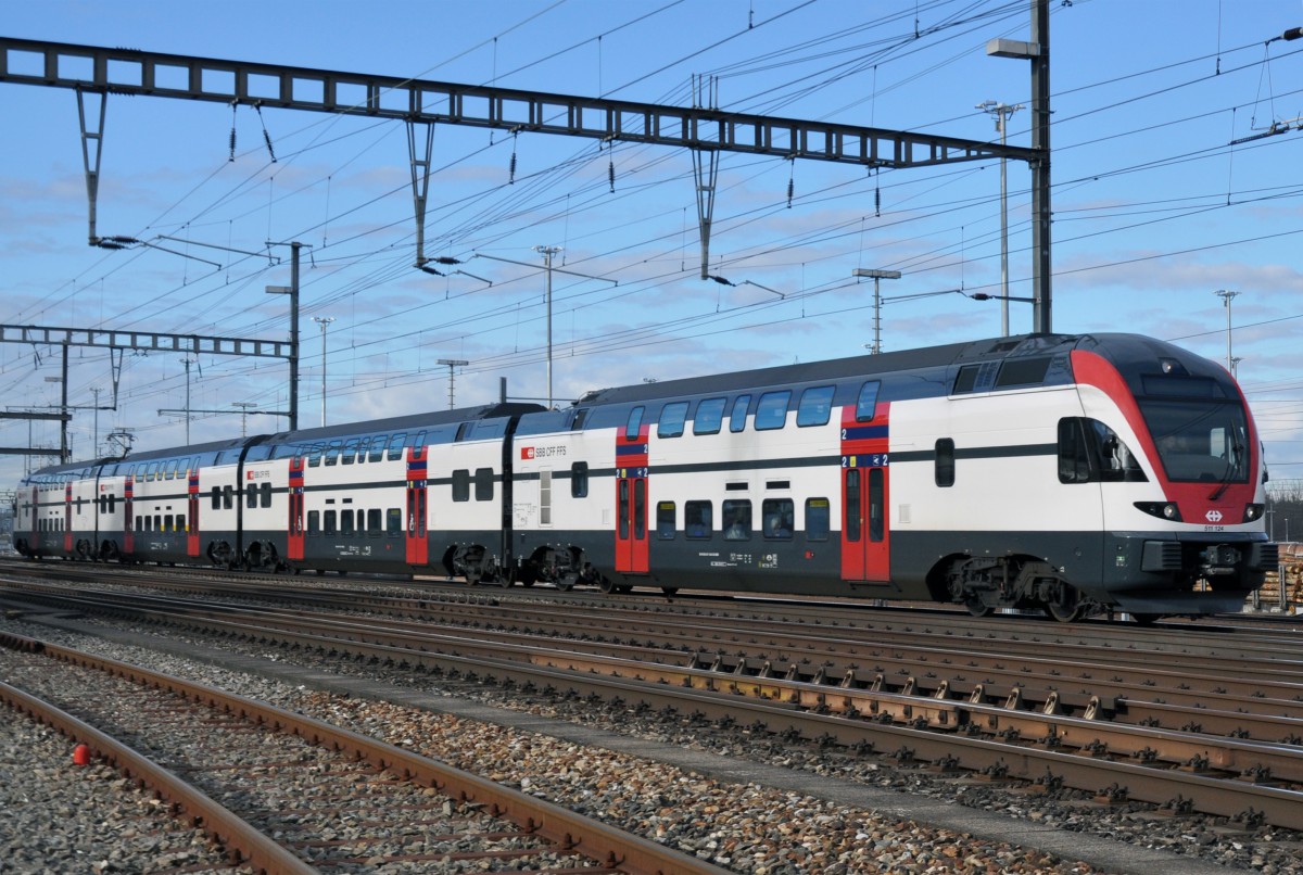 RABe 511 124 durchfährt den Bahnhof Muttenz. Die Aufnahme stammt vom 07.01.2014.