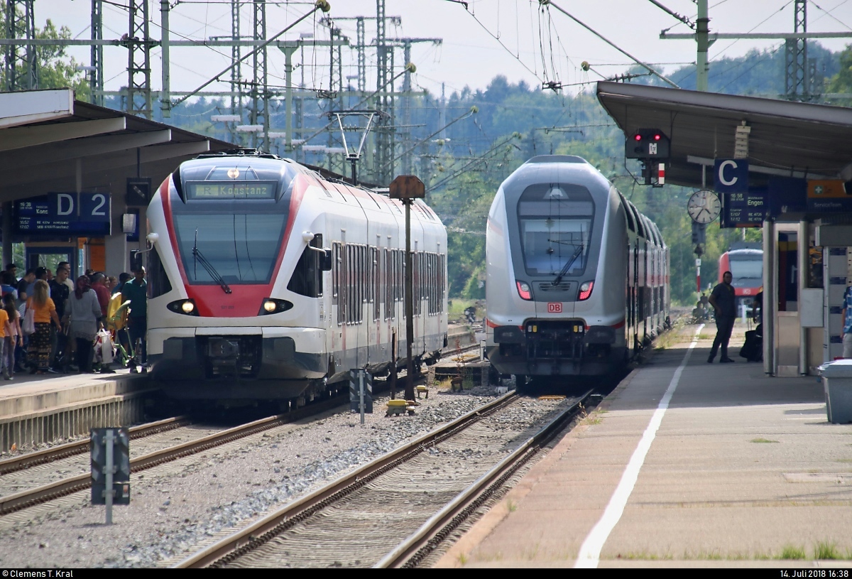 RABe 521 203-5 (Stadler FLIRT) der SBB GmbH (SBB) als SBB87695  Seehas  von Engen nach Konstanz trifft auf DBpbzfa 668.2 mit Zuglok 146 564-0 DB als IC 2384 (Linie 87) bzw. RE 52384 (RE87) von Singen(Hohentwiel) nach Stuttgart Hbf im Bahnhof Singen(Hohentwiel).
[14.7.2018 | 16:38 Uhr]