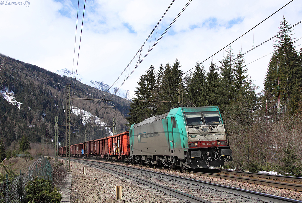 Rail Traction Companys` E483 003 heads a southbound freight train past Fleres, 27 March 2014
