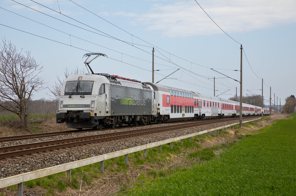RailAdventure 183 500 am 20.04.2023 mit den City Night Line Wagen aus Mukran, bei Bergen (Rügen).
