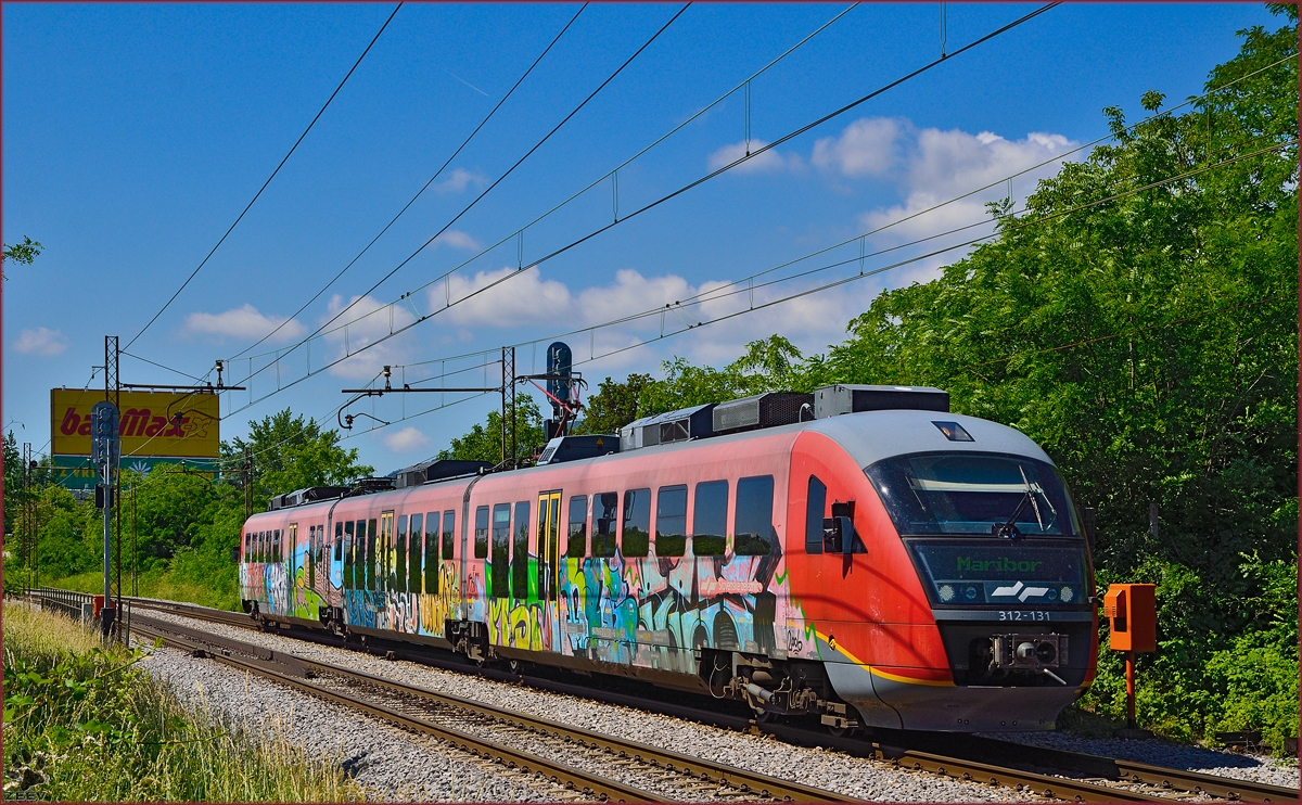 SŽ 312-131 fährt durch Maribor-Tabor Richtung Mariboe Hauptbahnhof. /6.6.2014