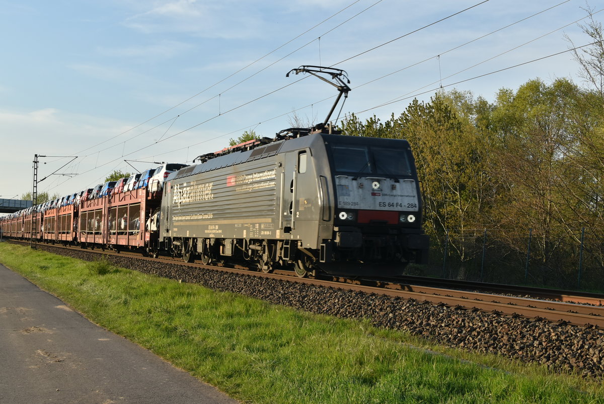 SBB Cargo 189 284 mit einem Autozug bei Kaarst Broicherseite gen Neuss fahrend. 18.4.2019