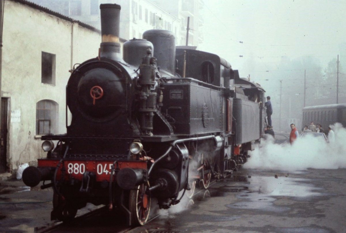 scan from dia : september 1983, 880.045 at Torino approach the double traction for a steam special train. This locomotive is property of Museo Ferroviario Piemontese.