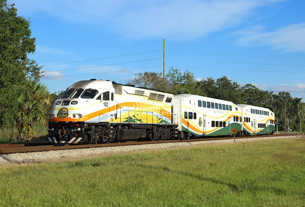 SunRail train P327, 1530 DeBary-Poinciana approaches Sanford, 21 Nov 2018.

102 provides the power at the rear...