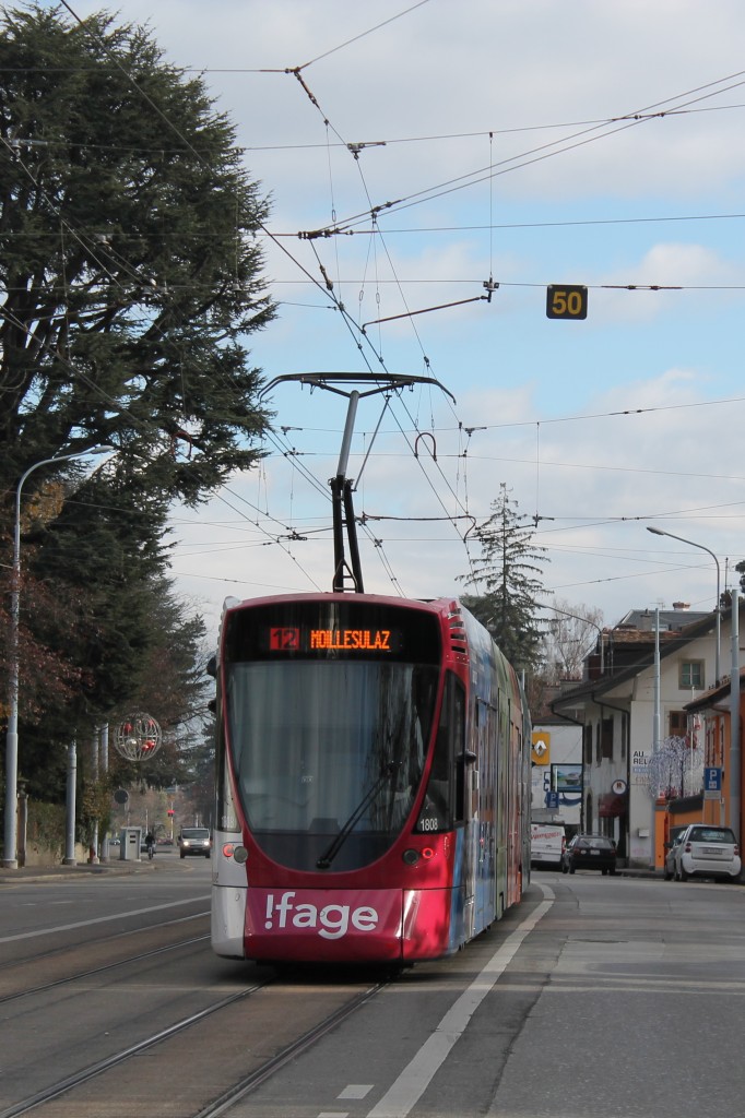 TPG STADLER TANGO 1808 mit !fage-Werbung unterwegs zwischen den Haltestellen Grange-Canal und Eremitage. 06.12.2013