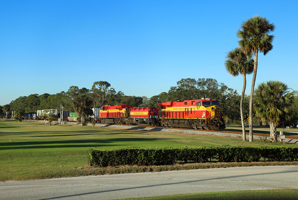 With engineer David Shelley (the `East Coast Hogger`) at the controls, FEC Nos. 803 & 821 pass through the middle of Daytona Beach Golf Club while working FEC101-26, 1400 Jacksonville Bowden-Miami Hialeah, 26 November 2017
