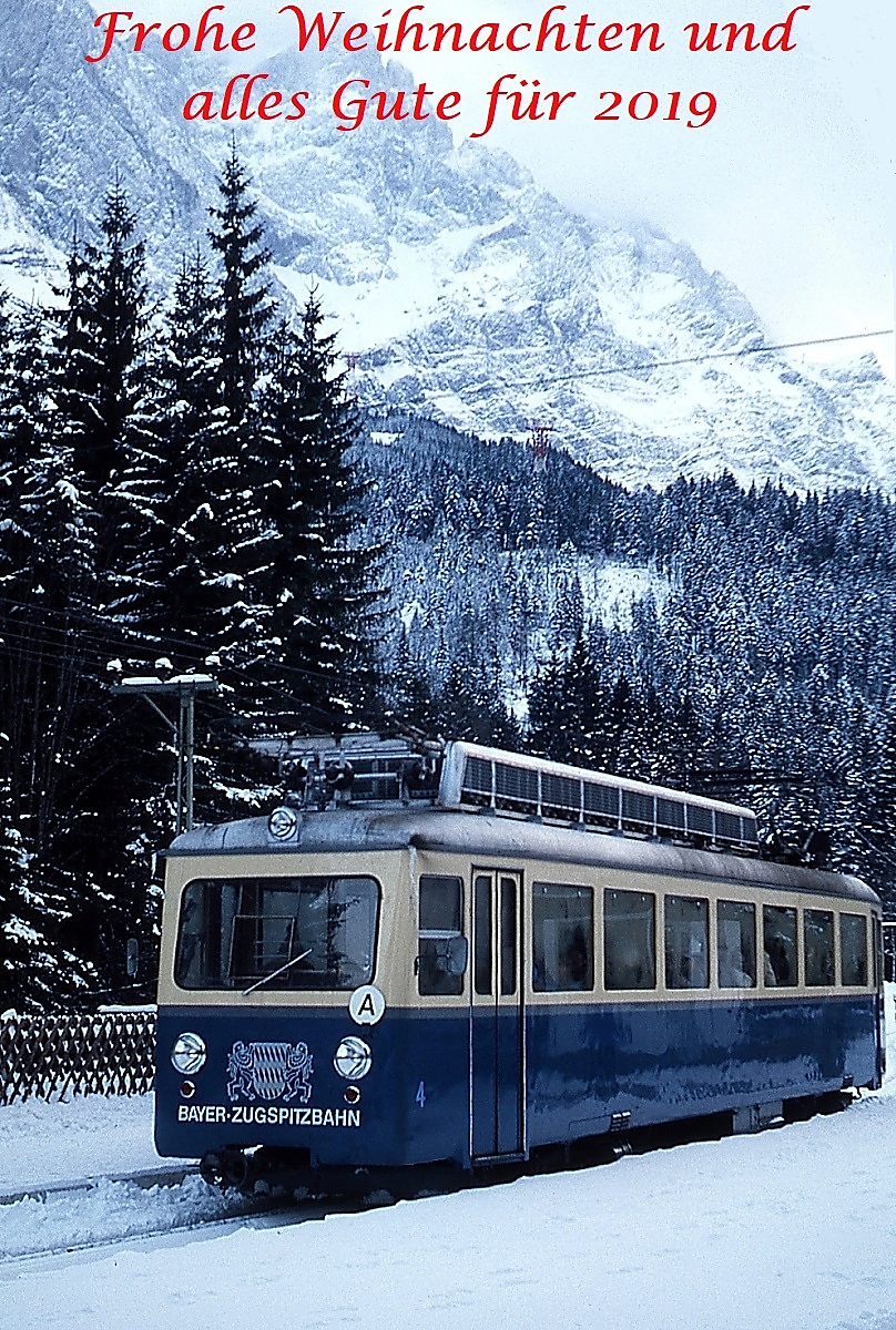 wünsche ich Euch mit diesem Bild des Tw 4 der Zugspitzbahn Anfang Januar 1980 im Bahnhof Eibsee