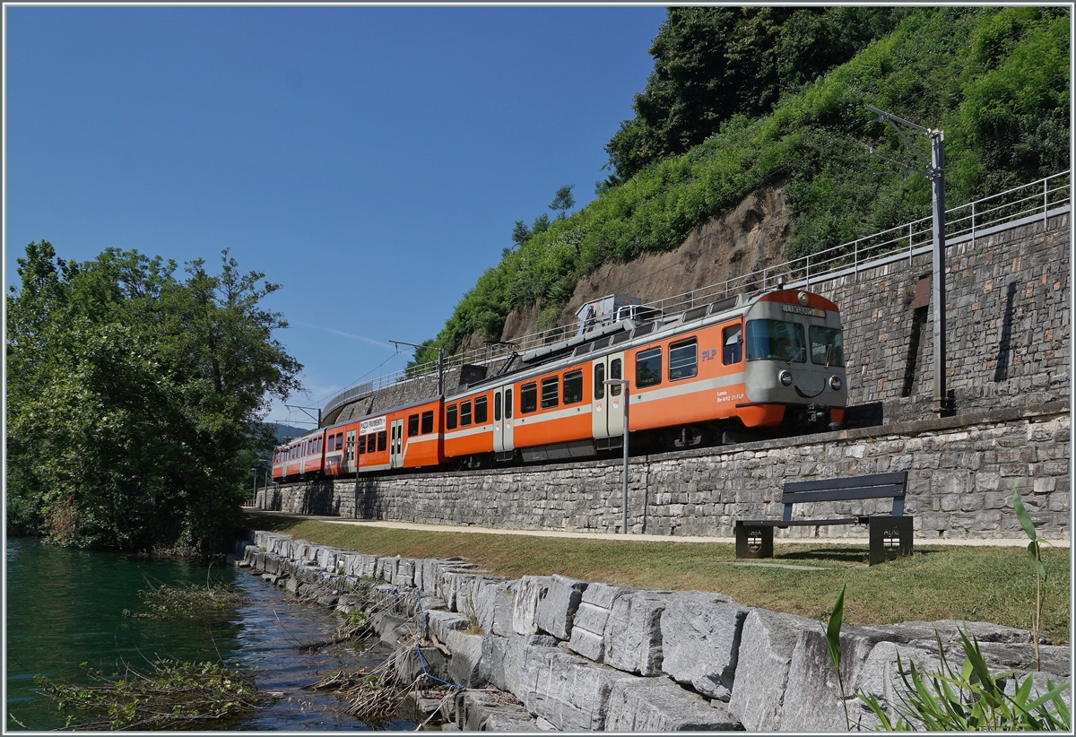 Ziel der Reise: die nur noch kurze Zeit lächelnden  Manderindli  der FLP; hier zeigt sich der FLP Be 4/12 21  LEMA  bei Agno auf der Fahrt nach Lugano. 

23. Juni 2021