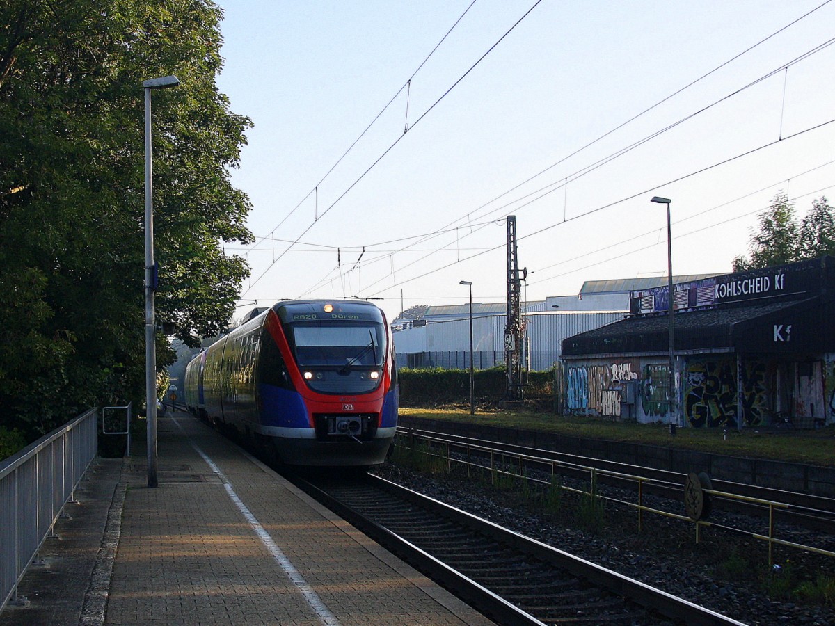 Zwei Euregiobahn (RB20) aus Heerlen(NL)-Stolberg-Altstadt-Düren kommt die Kohlscheider-Rampe hoch aus Richtung Herzogenrath und hält in Kohlscheid und fährt in Richtung Richterich,Laurensberg,Aachen-West. 
Bei schönem Sonnenschein am Morgen vom 12.9.2014.
