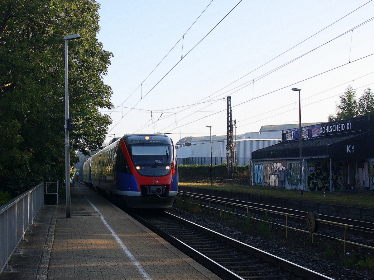 Zwei Euregiobahn (RB20) aus Heerlen(NL)-Stolberg-Altstadt-Düren kommt die Kohlscheider-Rampe hoch aus Richtung Herzogenrath und hält in Kohlscheid und fährt in Richtung Richterich,Laurensberg,Aachen-West. 
Bei schönem Sonnenschein am Morgen vom 12.9.2014.