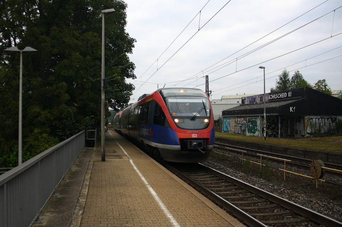 Zwei Euregiobahn (RB20) aus Heerlen(NL)-Stolberg-Altstadt-Düren kommt die Kohlscheider-Rampe hoch aus Richtung Herzogenrath und hält in Kohlscheid und fährt in Richtung Richterich,Laurensberg,Aachen-West.
Bei Wolken am Morgen vom 16.9.2014.