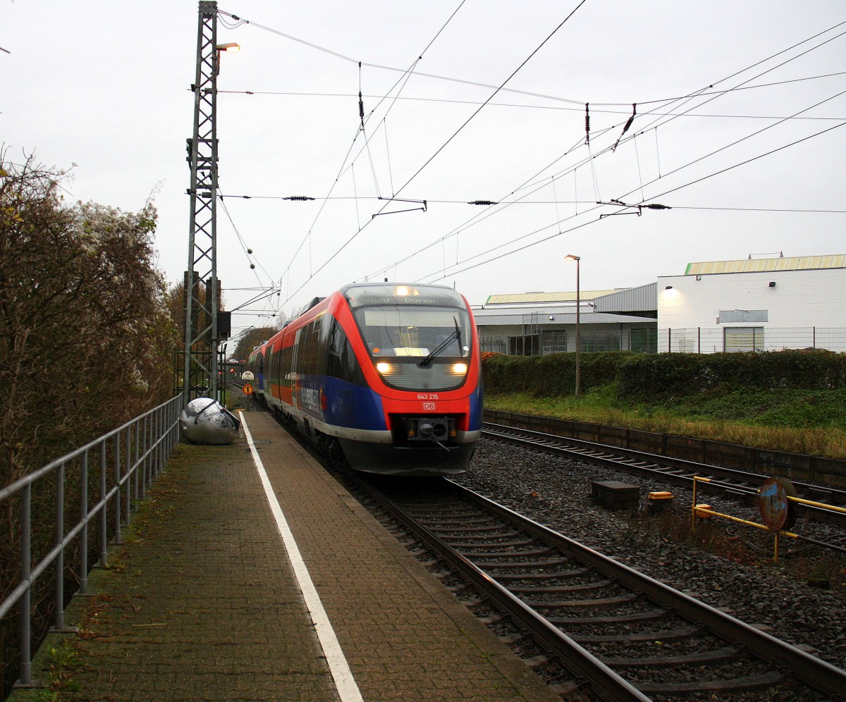 Zwei Euregiobahn (RB20) aus Heerlen(NL)-Stolberg-Hbf kommen die Kohlscheider-Rampe hoch aus Richtung Herzogenrath und halten in Kohlscheid und fahren in Richtung Richterich,Laurensberg,Aachen-West.
Bei Regenwolken  und Wind am Morgen vom 30.11.2015.