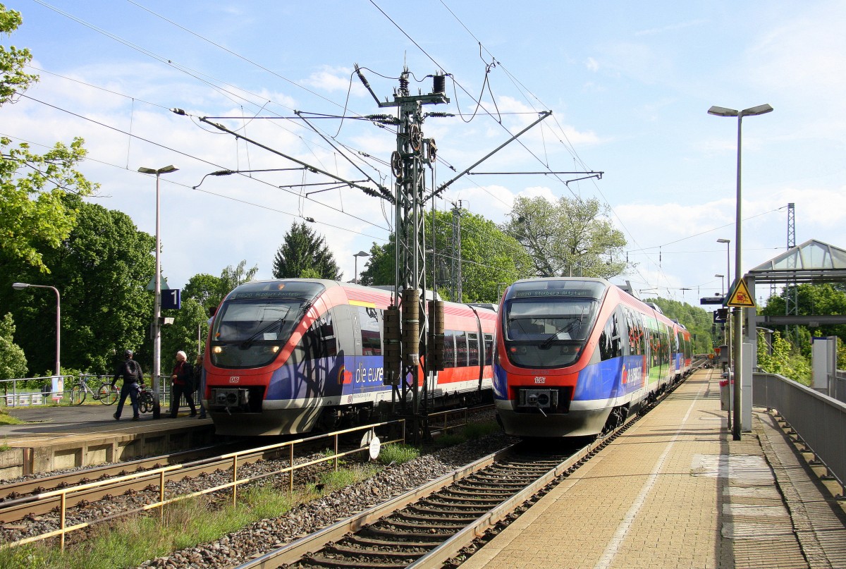 Zwei Euregiobahn (RB20) begegnen sich im Bahnhof Kohlscheid bei Sonne und Regenwolken
am 7.5.2014.