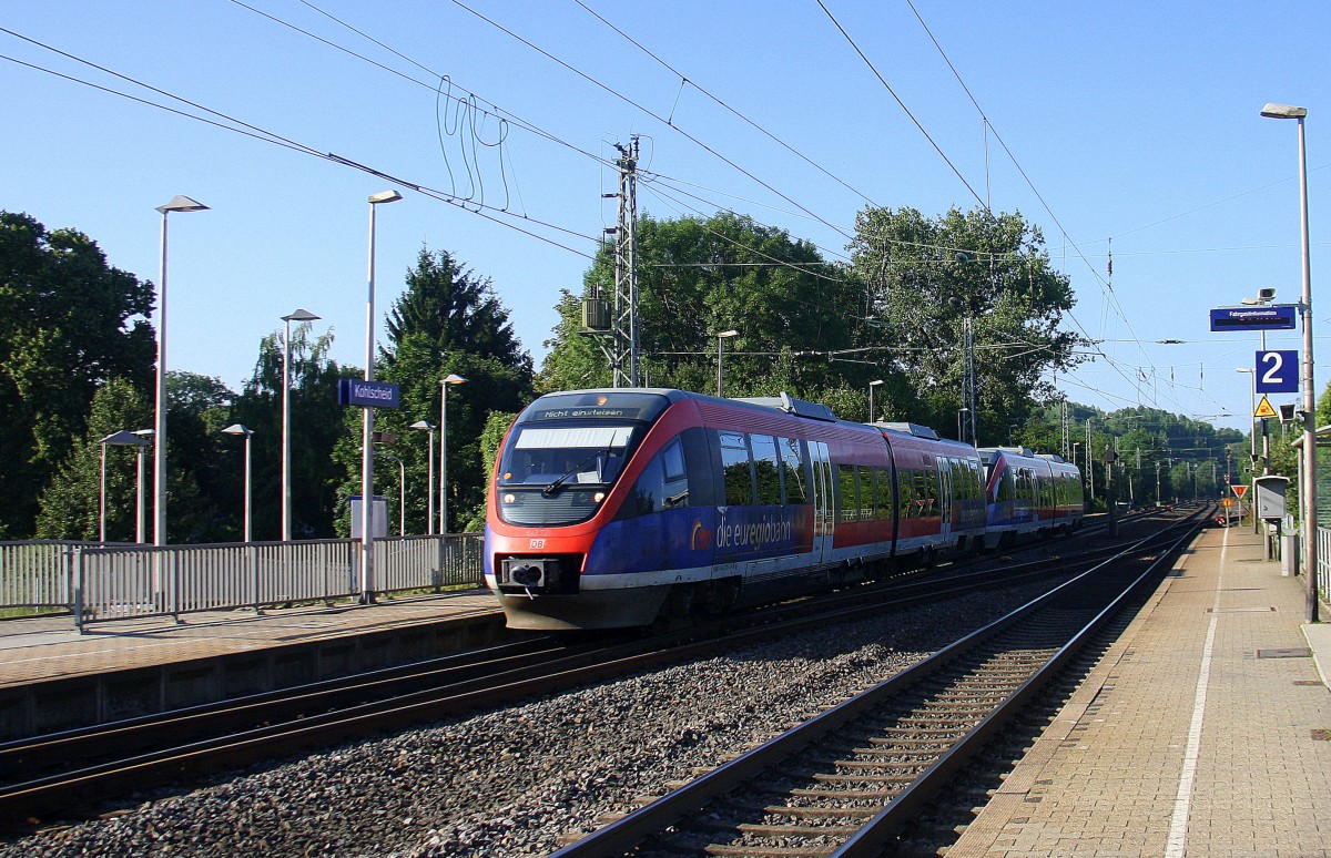 Zwei Euregiobahn (RB20) kommt aus Richtung Aachen-West,Laurensberg,Richterich und fährt durch Kohlscheid und fährt in Richtung Herzogenrath. 
Bei schönem Sonnenschein am Morgen vom 16.7.2014.