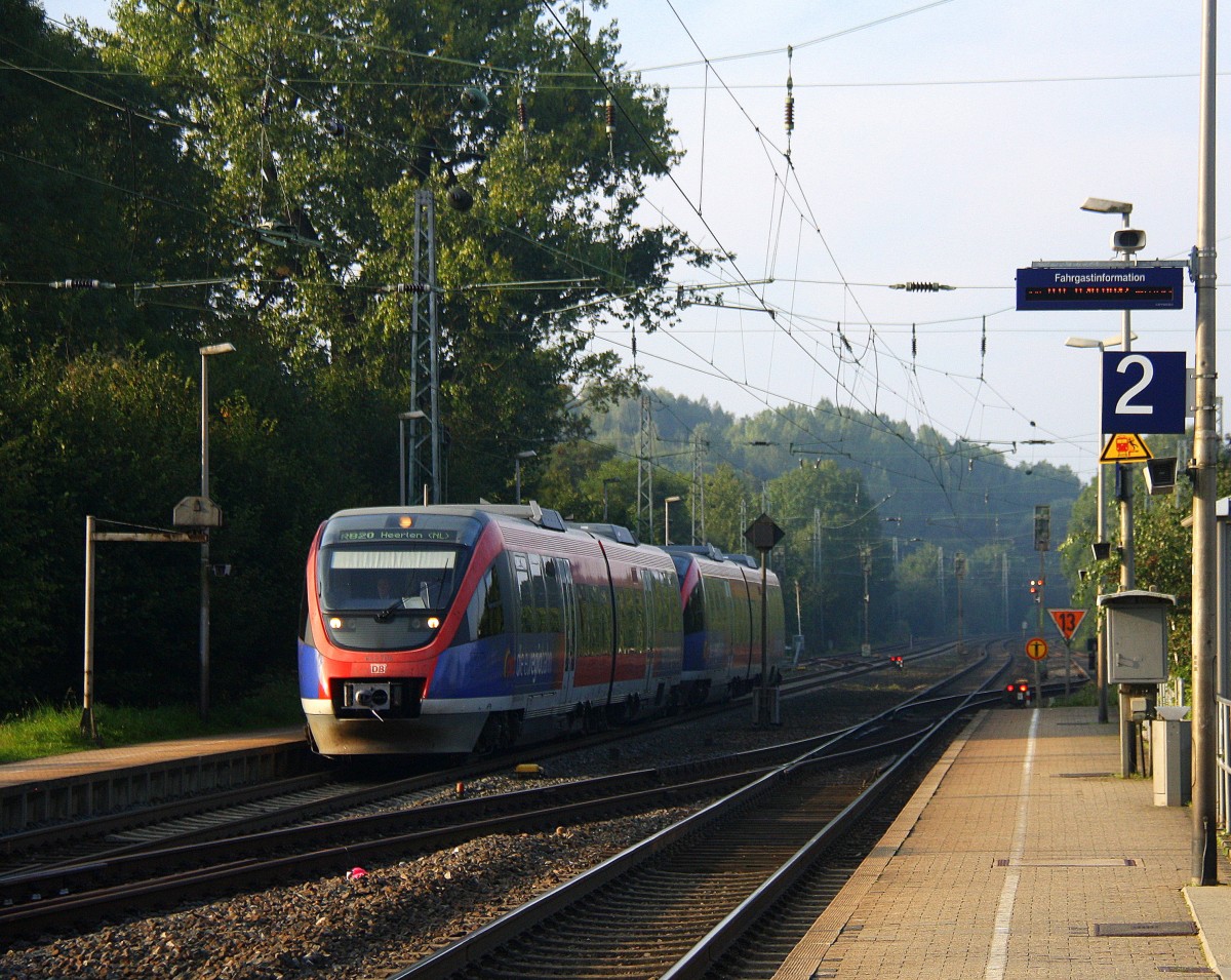 Zwei Euregiobahn (RB20) kommt aus Langerwehe-Stolberg-Altstadt nach Heerlen(NL) aus Richtung Aachen-West,Laurensberg,Richterich und hält in Kohlscheid und fährt in Richtung Herzogenrath.
Bei schönem Sonnenschein am Morgen vom 5.9.2014.