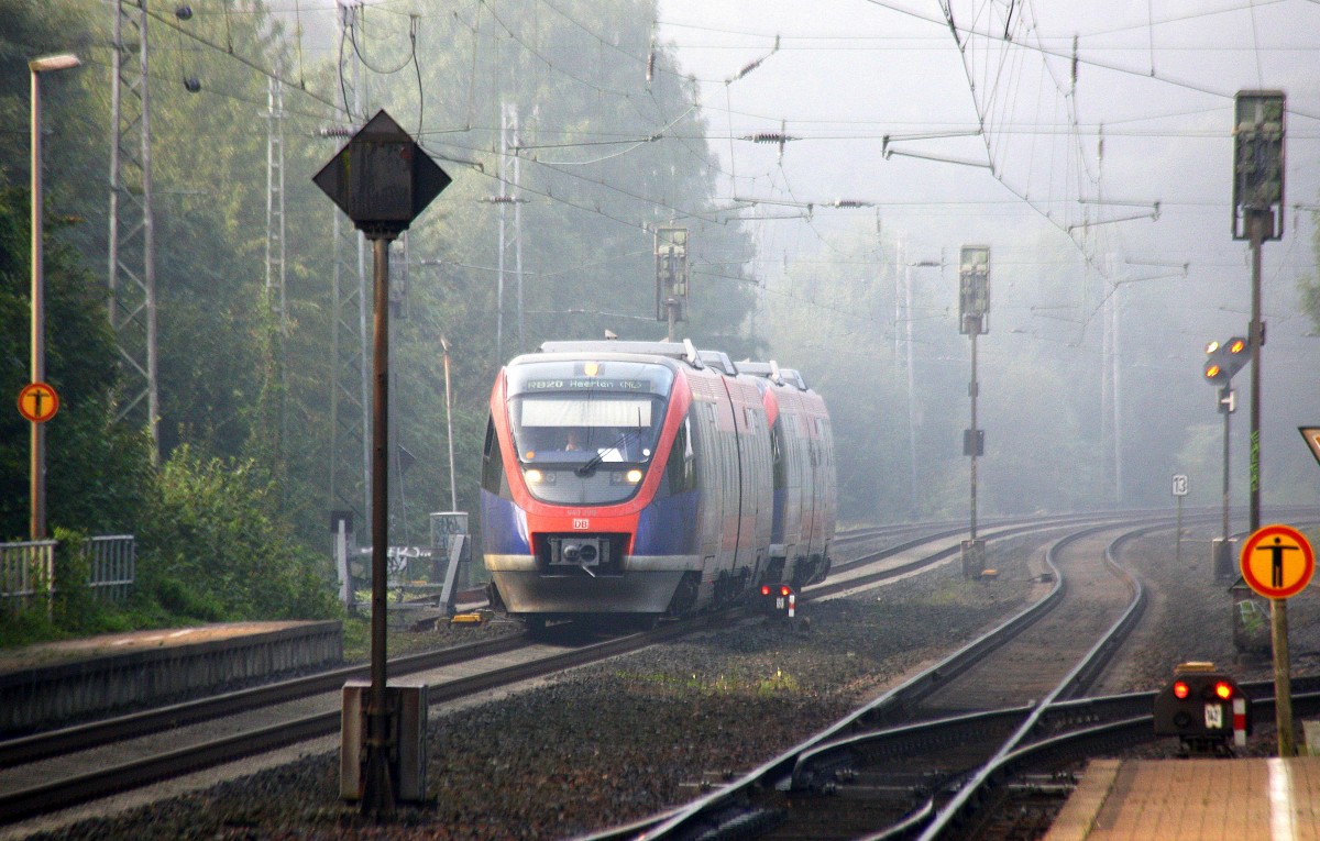Zwei Euregiobahn (RB20) kommt aus Langerwehe-Stolberg-Altstadt nach Heerlen(NL) aus Richtung Aachen-West,Laurensberg,Richterich und hält in Kohlscheid und fährt in Richtung Herzogenrath.
Bei Nebel am Morgen vom 8.9.2014.