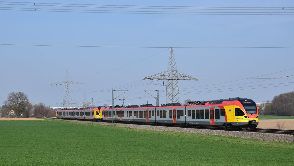 Zwei Flirt 2er der HLB als RE98/99 nach Frankfurt Hbf zwischen Groß Karben und Dortelweil. Aufgenommen am 23.3.2019 13:25