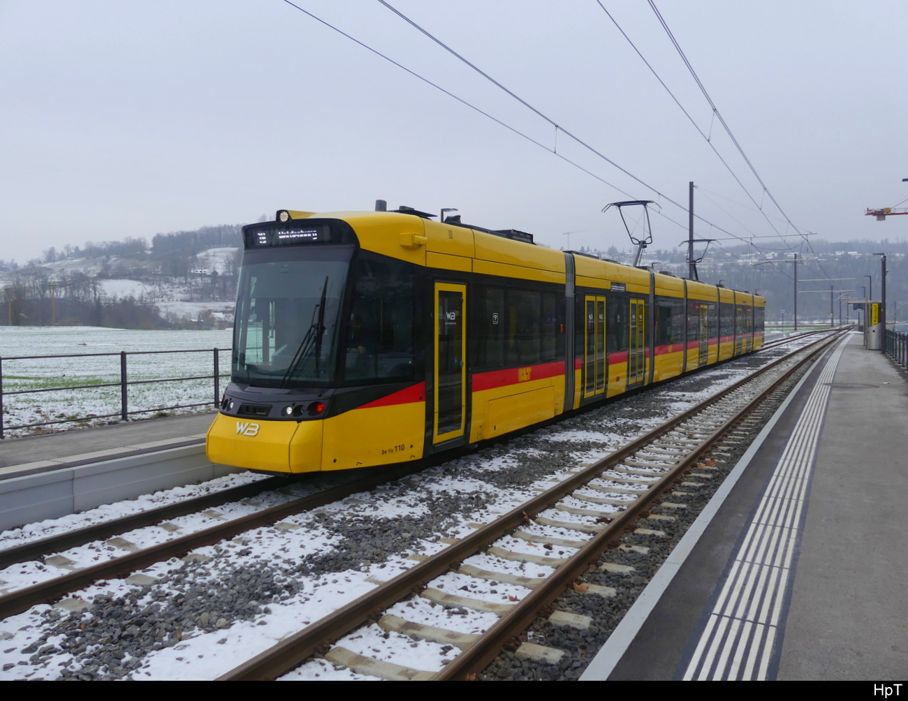 BLT / WB - Be 6/8 110 unterwegs nach Waldenburg in der Haltestelle Bad Bubendorf am 13.02.2024
