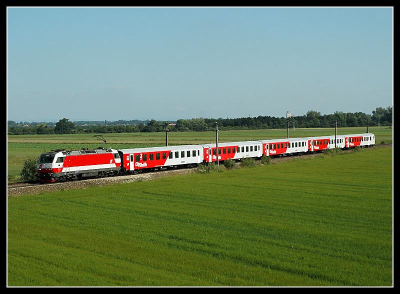 1014 002 am 11.6.2006 mit dem E 2817  Blaufrnkisch  auf dem Weg nach Deutschkreuz kurz nach dem Bahnhof Wampersdorf.