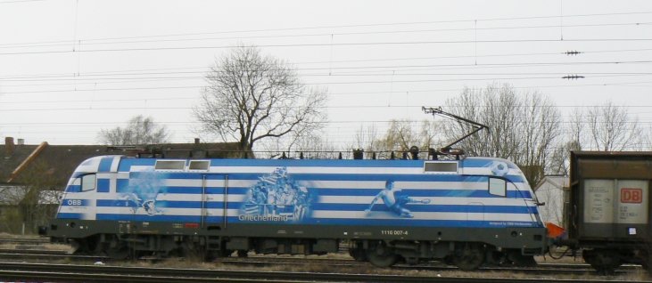 1116 007 (EM Griechenland) unterwegs im Mrz 2008 an einem Gterzug in Mnchen Trudering.