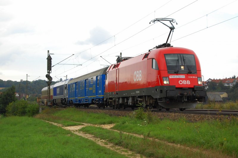 1116 231-0 zog am 21.08.07 eine berfhrungsfahrt der Voith Maxima 40CC nach Ulm, wobei in den nchsten Tagen Testfahrten fr die Lok zwischen Ulm und Geislingen (Steige) vorgesehen sind, die mit dieser Garnitur gefahren wird. Die Aufnahme entstand in Hhe Halzhausen an der Filsbahn.