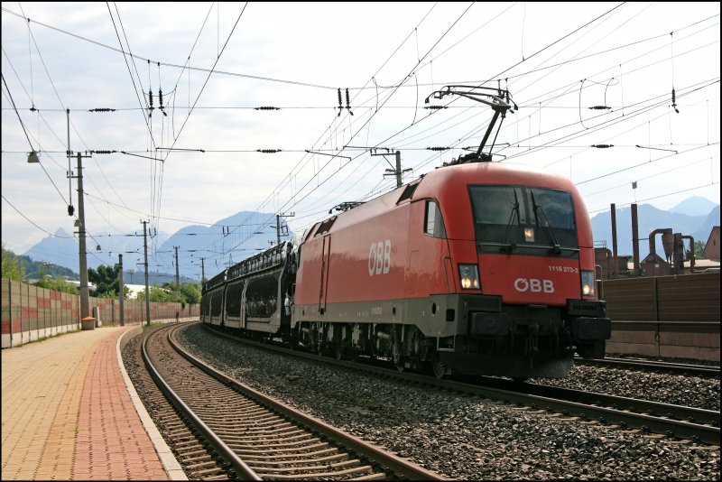 1116 273 legt sich mit dem GAG 46678(?), Novo Mesto - Mulhouse, in Kundl in die Kurve. (05.07.2008)
