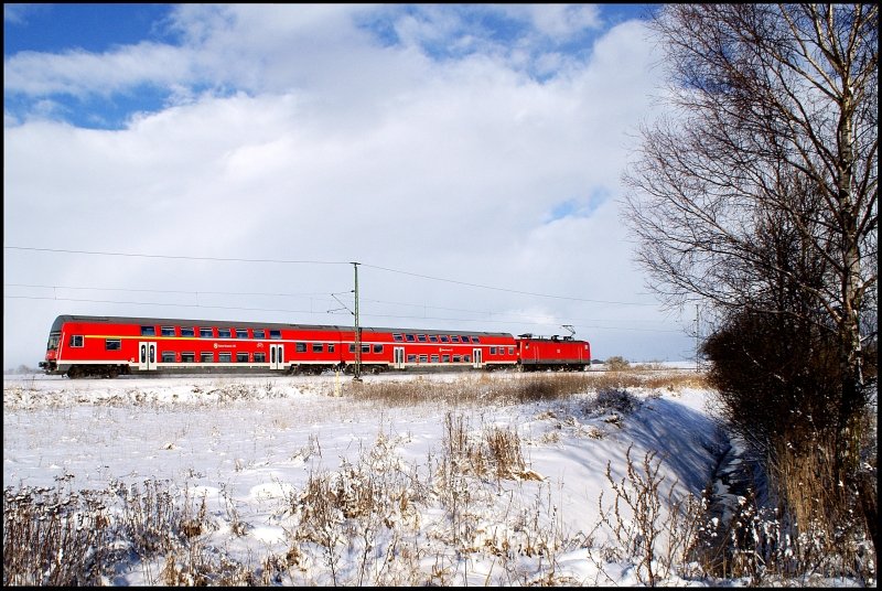 112 102-9 mit RE 94744 Elmenhorst-Stralsund am 17.02.2009 zwischen Wendorf und Voigdehagen.