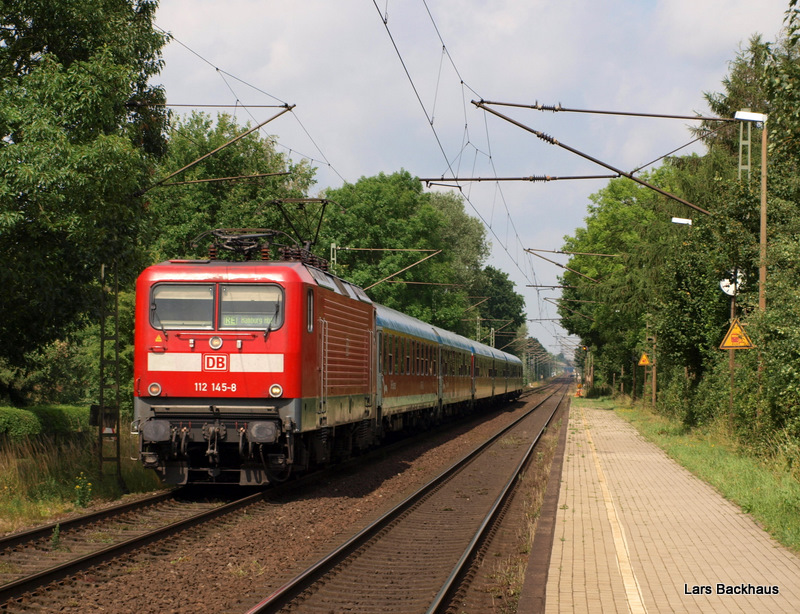 112 145-8 rast am 6.07.09 mit RE 21067  SH-Express  Padborg st - Hamburg Hbf mit 160 km/h durch Prisdorf Richtung Hamburg-Dammtor.