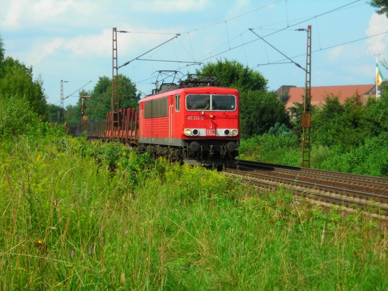 155 034 mit einem leerem Holzzug in Limmer