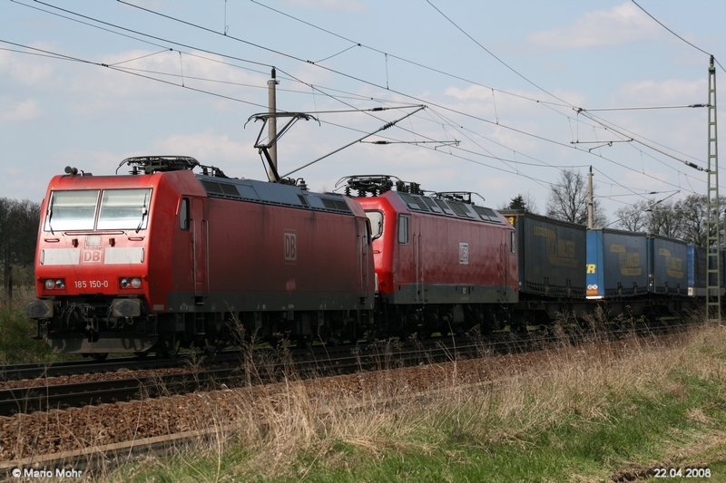 185 150 und MEG 156 002-8 mit LKW Anhngern gen Sden.