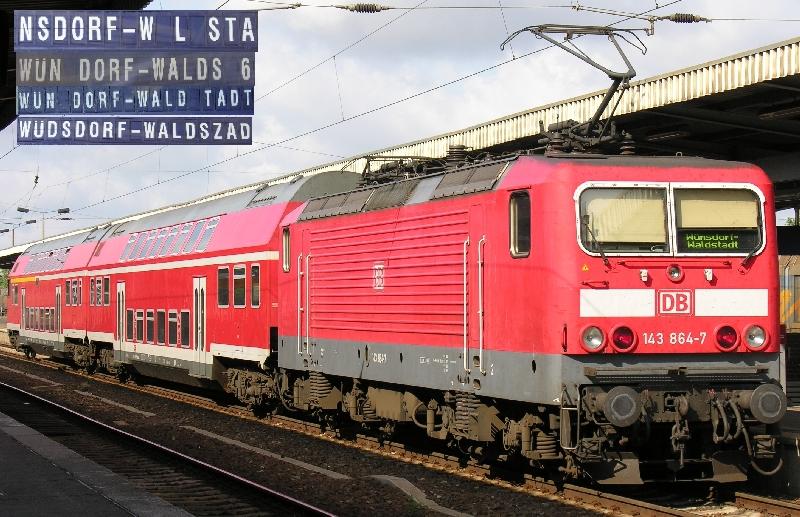 Am 16.7.2005 in Berlin Schnefeld die 143864 mit dem Regionalzug nach Wnsdorf Waldstadt und wie der Zug durch Zugzielfalschanzeiger angezeigt wird. Die Anzeige NSDORF ist schon ein starkes Stck, auch wenn es zufllig jeden Tag so ist. brigens hatte der Zug laut Anzeige mindestens 3 verschiedene Zugnummern. 