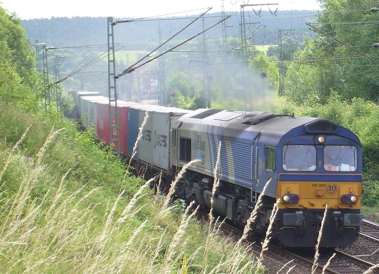 Claas 6610 mit einem Containerumleiter ber Altenbeken,da zwischen Seelze und Wunstorf eine Baustelle ist.