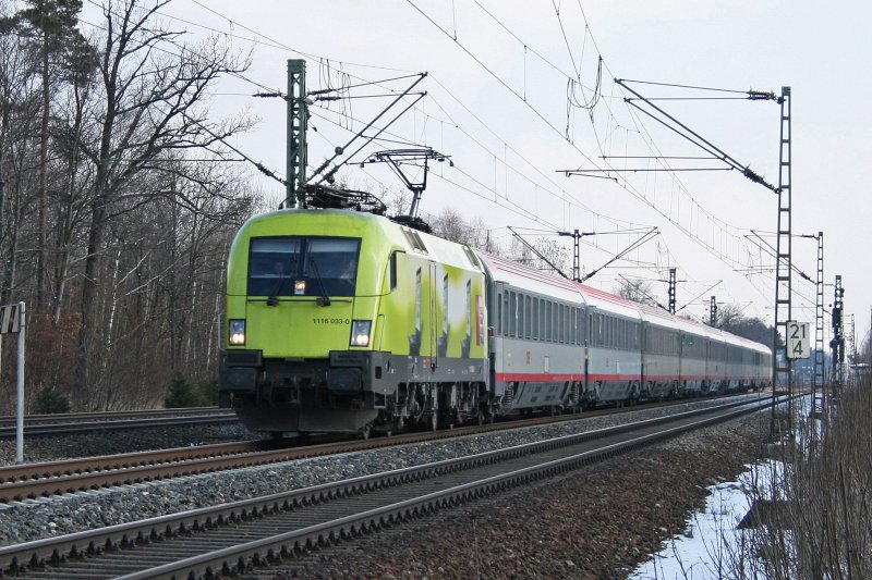 Die Telekom Lok 1116 033 mit EC 262 am 31.01.2009 in Haar.