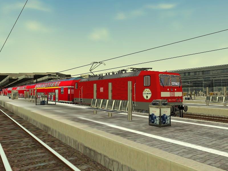 Ein Download von the-train.de: BR 143 216-0 im Hauptbahnhof Stuttgart mit RE 160-Dostos auf Gleis 16.