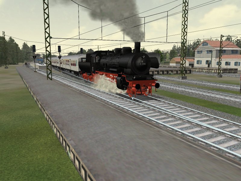 Eine 38er Lok mit Silberlingen bei der Ausfahrt Kahl/Main