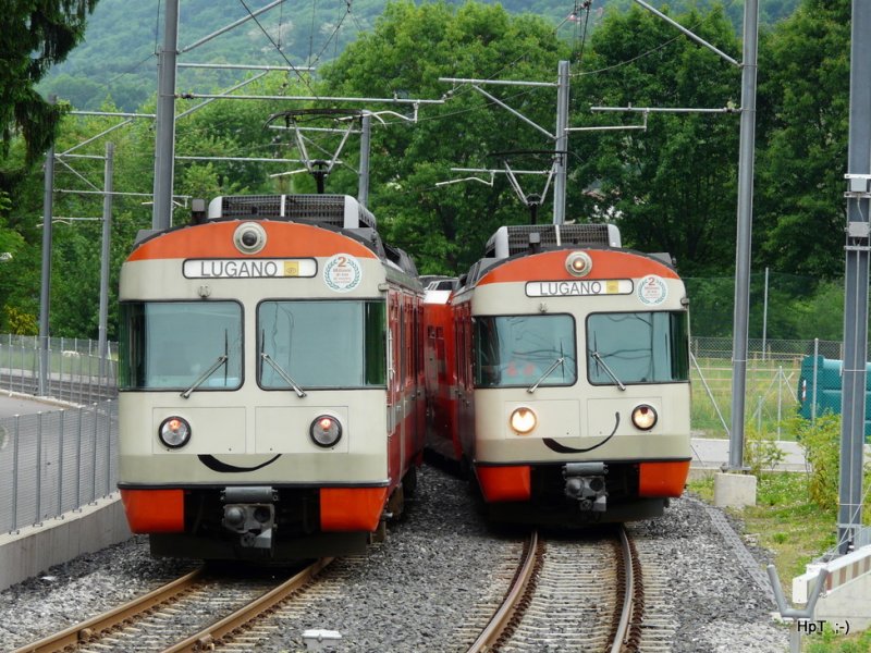 FLP - Bei Magliaso unterwegs sind die Triebwagen Be 4/12 25 als Regio nach Ponte Tresa und der Triebwagen Be 4/12 23 als Regio nach Lugano am 13.05.2009