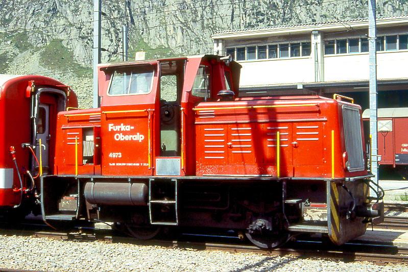 FO - Tm 2/2 4973 am 25.08.1996 in ANDERMATT - Diesel-TRAKTOR fr Bau- und Rangierdienst Andermatt ohne Zahnrad.- Baujahr 1958 - RUHRTALER3575 - Motor Motorenwerke Mannheim RHS518A - 175 KW - Gewicht 23,00t - LP 7,85m - zulssige Geschwindigkeit km/h 30 - Mutation: 1958 - 1975 als V 19  KERKERBACH  bei der Kerkerbachbahn 1000mm im Einsatz, nach Stillegung der Meterspurstrecke 1961 Umbau auf Normalspur, 1975 bergang der Bahn an DB V19=333 902. 1979 Verkauf ber Asper an FO. Nach Rckspurung auf Meterspur ab 1981 im Einsatz.
