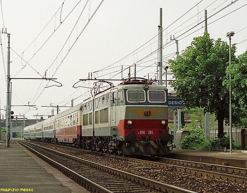 FS E656 293 hauling the IC74  Tiziano  crossing Desio station on the 10th of May in 1987
